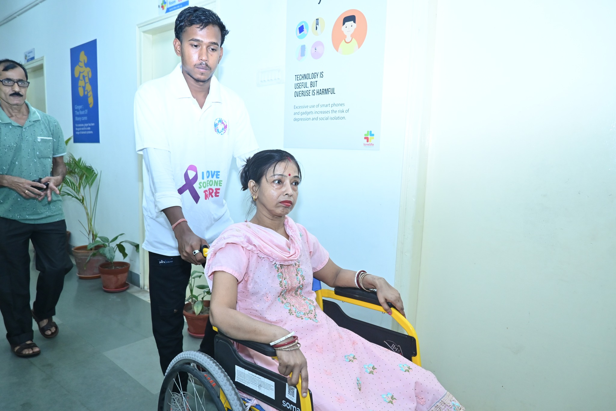A volunteer helping at an information booth at the 2025 event.